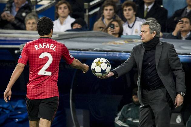 13.02.2013 Madrid, Spain. Head Coach Jose Mourinho of Real Madrid (R) gives the ball to Defender Rafael of Manchester United during the Champions League game between Real Madrid and Manchester United . xIvanxArlandisx  ActionPlus224120