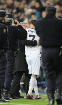Sir Alex Ferguson manager of Manchester United and Cristiano Ronaldo of Real Madrid hug at the end of the match - UEFA Champions League First Knockout Round 1st leg - Real Madrid vs Manchester Utd - Bernabau Stadium - Madrid - 13 11 12 - - EDITORIAL USE ONLY. No use with unauthorised audio, video, data, fixture lists, club league logos or live services. Online in-match use limited to 120 images, no video emulation. No use in betting, games or single club league player publications.