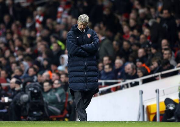 Arsenal s Arsene Wenger looks on dejected..Arsenal v Bayern Munich - Champions League Second Round, First Leg- Emirates Stadium, London- 19 02 13 - Picture David Klein Sportimage EDITORIAL USE ONLY. No use with unauthorised audio, video, data, fixture lists, club league logos or live services. Online in-match use limited to 120 images, no video emulation. No use in betting, games or single club league player publications.