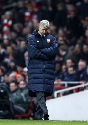 Arsenal s Arsene Wenger looks on dejected..Arsenal v Bayern Munich - Champions League Second Round, First Leg- Emirates Stadium, London- 19 02 13 - Picture David Klein Sportimage EDITORIAL USE ONLY. No use with unauthorised audio, video, data, fixture lists, club league logos or live services. Online in-match use limited to 120 images, no video emulation. No use in betting, games or single club league player publications.