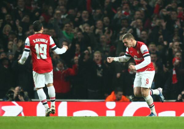 Arsenal s Lukas Podolski celebrates scoring his sides first goal Football - UEFA Champions League - round of 16 - First Leg - Arsenal London v Bayern Munich - 19th February 2013 - Emirates Stadium - London - UK 19022013ArsenalvsBayernMZE08