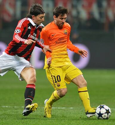 Riccardo Montolivo Milan, Lionel Messi Barcelona.Milano 20 02 2013 Stadio San Siro - Giuseppe Meazza.Football Calcio 2012 2013 Champions League. AC Milan vs. FC Barcelona -- andreaxstaccioli