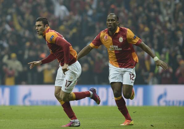 UEFA Champions League last sixteen first leg match between Galatasaray and Schalke 04 at Turk Telekom Arena Stadium in Istanbul on 20.02.2013 Pictured: Burak Yilmaz and Didier Drogba of Galatasaray. 