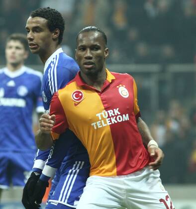 UEFA Champions League last sixteen first leg match between Galatasaray and Schalke 04 at Turk Telekom Arena Stadium in Istanbul on 20.02.2013 Pictured: Didier Drogba of Galatasaray and Joel Matip of Schalke 04. 
