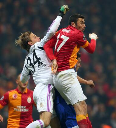 UEFA Champions League last sixteen first leg match between Galatasaray and Schalke 04 at Turk Telekom Arena Stadium in Istanbul on 20.02.2013 Pictured: Burak Yilmaz of Galatasaray and Goalkeeper Timo Hildebrand of Schalke 04. 