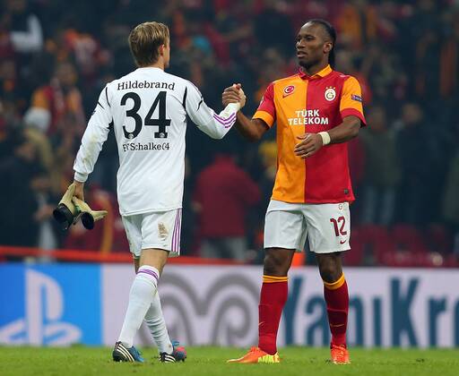 UEFA Champions League last sixteen first leg match between Galatasaray and Schalke 04 at Turk Telekom Arena Stadium in Istanbul on 20.02.2013 Pictured: Didier Drogba of Galatasaray and Goalkeeper Timo Hildebrand of Schalke 04. 