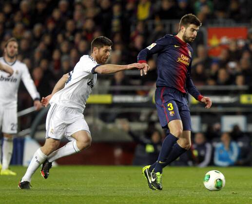 Copa del Rey. FC Barcelona vs Real Madrid. Gerard Pique and Xabi Alonso.
