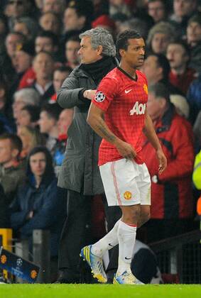 Nani of Manchester United receives a consoling pat on the back off Jose Mourinho manager of Real Madrid - UEFA CHAMPIONS LEAGUE - ROUND OF 16 - Manchester Utd vs Real Madrid - Old Trafford Stadium - Manchester - 05 03 13 - Picture Simon Bellis Sportimage- EDITORIAL USE ONLY. No use with unauthorised audio, video, data, fixture lists, club league logos or live services. Online in-match use limited to 120 images, no video emulation. No use in betting, games or single club league player publications.