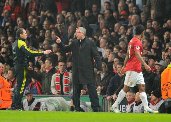 Sir Alex Ferguson manager of Manchester United points furiously as Nani of Manchester United walks past having been sent off for a high challenge - UEFA CHAMPIONS LEAGUE - ROUND OF 16 - Manchester Utd vs Real Madrid - Old Trafford Stadium - Manchester - 05 03 13 - Picture Simon Bellis Sportimage- EDITORIAL USE ONLY. No use with unauthorised audio, video, data, fixture lists, club league logos or live services. Online in-match use limited to 120 images, no video emulation. No use in betting, games or single club league player publications.