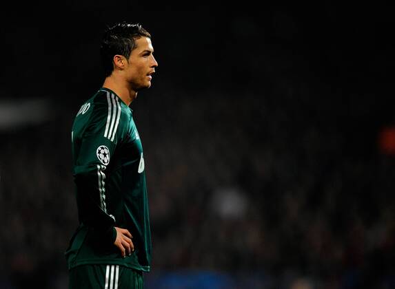 Cristiano Ronaldo of Real Madrid - UEFA CHAMPIONS LEAGUE - ROUND OF 16 - Manchester Utd vs Real Madrid - Old Trafford Stadium - Manchester - 05 03 13 - Picture Simon Bellis Sportimage- EDITORIAL USE ONLY. No use with unauthorised audio, video, data, fixture lists, club league logos or live services. Online in-match use limited to 120 images, no video emulation. No use in betting, games or single club league player publications.
