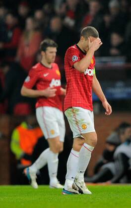 Dejection for Nemanja Vidic of Manchester United - UEFA CHAMPIONS LEAGUE - ROUND OF 16 - Manchester Utd vs Real Madrid - Old Trafford Stadium - Manchester - 05 03 13 - Picture Simon Bellis Sportimage- EDITORIAL USE ONLY. No use with unauthorised audio, video, data, fixture lists, club league logos or live services. Online in-match use limited to 120 images, no video emulation. No use in betting, games or single club league player publications.
