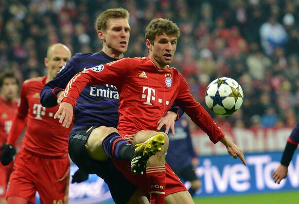 13.03.2013, xjhx, UEFA Champions League, FC Bayern München - Arsenal London, v.l. Per Mertesacker (Arsenal London), Thomas Müller (FC Bayern München)