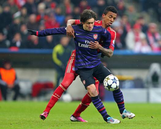 FUSSBALL - CL, Bayern vs Arsenal MUENCHEN,DEUTSCHLAND,13.MAR.13 - FUSSBALL - UEFA Champions League, Achtelfinale, FC Bayern München vs Arsenal FC. Bild zeigt Tomas Rosicky (Arsenal) und Luiz Gustavo (Bayern). 