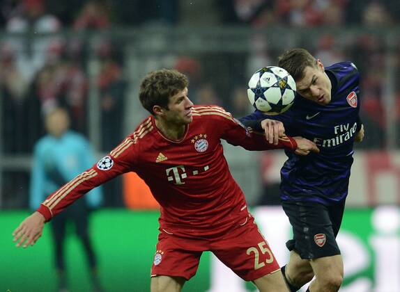 13.03.2013, xjhx, UEFA Champions League, FC Bayern München - Arsenal London, v.l. Thomas Müller (FC Bayern München), Aaron Ramsey (Arsenal London)