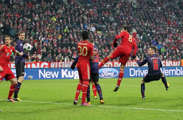 Arsenal s Laurent Koscielny scoring his sides second goal..Bayern Munich v Arsenal- UEFA Champions League - Second Round, Second Leg - Allianz Arena, Munich- 13 03 13 - Picture David Klein Sportimage EDITORIAL USE ONLY. No use with unauthorised audio, video, data, fixture lists, club league logos or live services. Online in-match use limited to 120 images, no video emulation. No use in betting, games or single club league player publications.