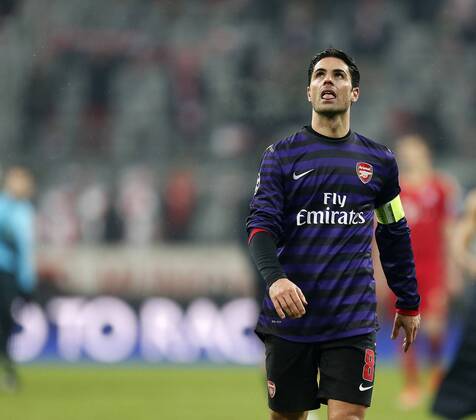 Arsenal s Mikel Arteta looks on dejected at the final whistle..Bayern Munich v Arsenal- UEFA Champions League - Second Round, Second Leg - Allianz Arena, Munich- 13 03 13 - Picture David Klein Sportimage EDITORIAL USE ONLY. No use with unauthorised audio, video, data, fixture lists, club league logos or live services. Online in-match use limited to 120 images, no video emulation. No use in betting, games or single club league player publications.