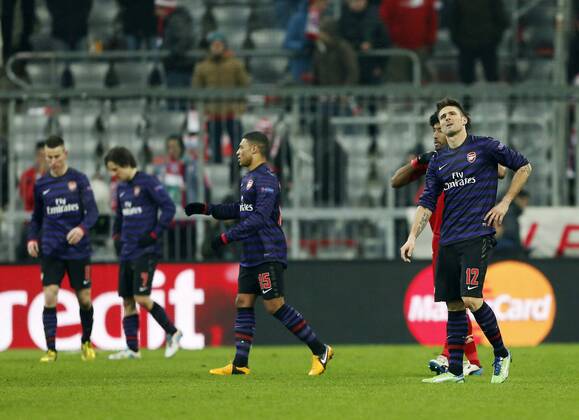 Arsenal s Olivier Giroud looks on dejected at the final whistle..Bayern Munich v Arsenal- UEFA Champions League - Second Round, Second Leg - Allianz Arena, Munich- 13 03 13 - Picture David Klein Sportimage EDITORIAL USE ONLY. No use with unauthorised audio, video, data, fixture lists, club league logos or live services. Online in-match use limited to 120 images, no video emulation. No use in betting, games or single club league player publications.