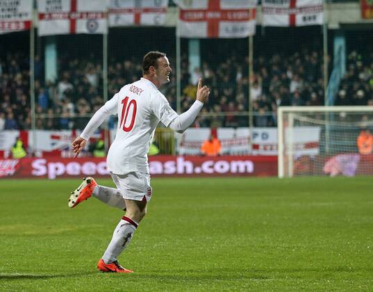 England s Wayne Rooney celebrates scoring his sides opening goal..Montenegro v England- World Cup Qualifier - Podgorica City Stadium, Podgorica- 26 03 13 - Picture David Klein Sportimage EDITORIAL USE ONLY. No use with unauthorised audio, video, data, fixture lists, club league logos or live services. Online in-match use limited to 120 images, no video emulation. No use in betting, games or single club league player publications.