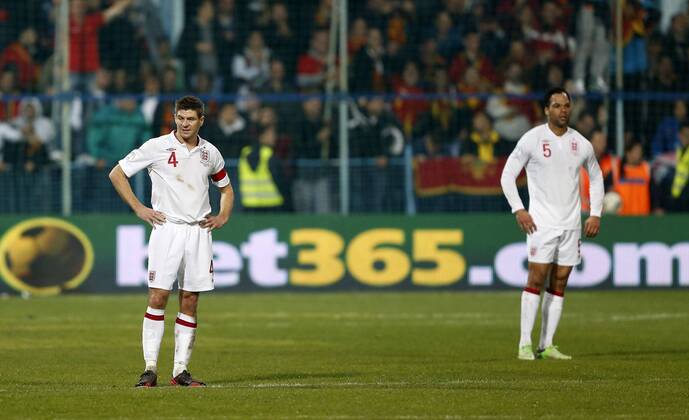 England s Steven Gerrard looks on dejected after going 1-1..Montenegro v England- World Cup Qualifier - Podgorica City Stadium, Podgorica- 26 03 13 - Picture David Klein Sportimage EDITORIAL USE ONLY. No use with unauthorised audio, video, data, fixture lists, club league logos or live services. Online in-match use limited to 120 images, no video emulation. No use in betting, games or single club league player publications.