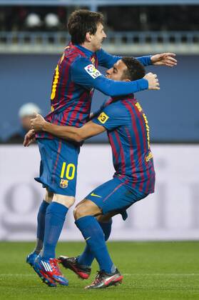 22.01.2012, Primera Division, FC Malaga - FC Barcelona v.l.Lionel Messi from Argentina (FC Barcelona) reacts after scoring 0:3 against Malaga CF during a Spanish La Liga soccer match Thiago Alcantara from Italy (FC Barcelona)