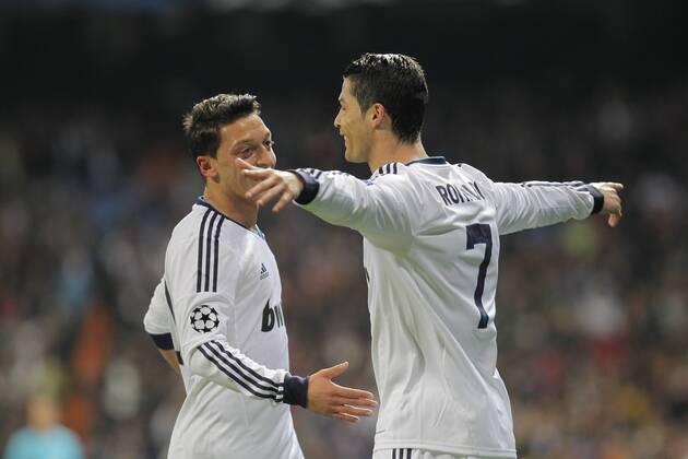 Soccer match between Real Madrid and Galatasaray corresponding to round of 4th first leg of the Champions League, held at the Santiago Bernabeu stadium, in Madrid 4 3 2013. Cristiano Ronaldo celebrate after scoring with Mesut Özil 