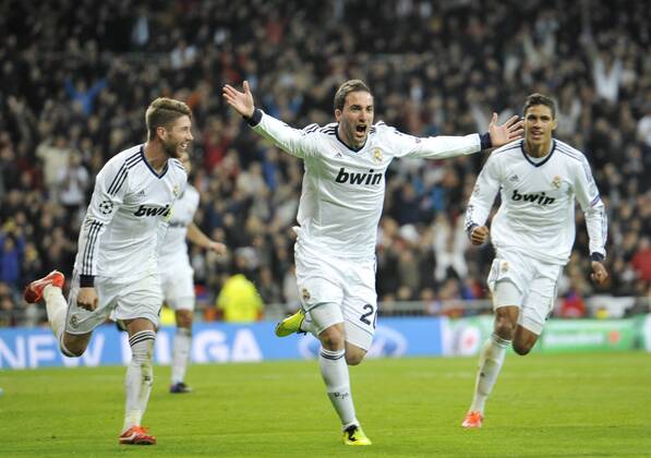 Gonzalo Higuain, striker of Real Madrid and Argentina , celebrating his goal ( 3-0 ) with Sergio Ramos and Raphael Varane- Real Madrid - Galatasaray - UEFA Champions League 2012 2013 - Quarters Finals- First Leg Match- 03 04 2013 - xFrancescaxCeciarini NJF Media 