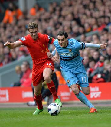 Jordan Henderson of Liverpool tussles with Joey O Brien of West Ham United - Barclays Premier League - Liverpool FC - West Ham United. Anfield Stadium - Liverpool - England - 07 04 13 - EDITORIAL USE ONLY. No use with unauthorised audio, video, data, fixture lists, club league logos or live services. Online in-match use limited to 120 images, no video emulation. No use in betting, games or single club league player publications.