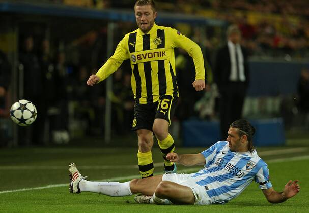 09.04.2013, Fussball Champions League Viertelfinale Rückspiel: Borussia Dortmund - FC Malaga, im Signal-Iduna-Park-Stadion Dortmund. v.l. Jakub Kuba Blaszczykowski (Dortmund) gegen Martin Demichelis (FC Malaga)