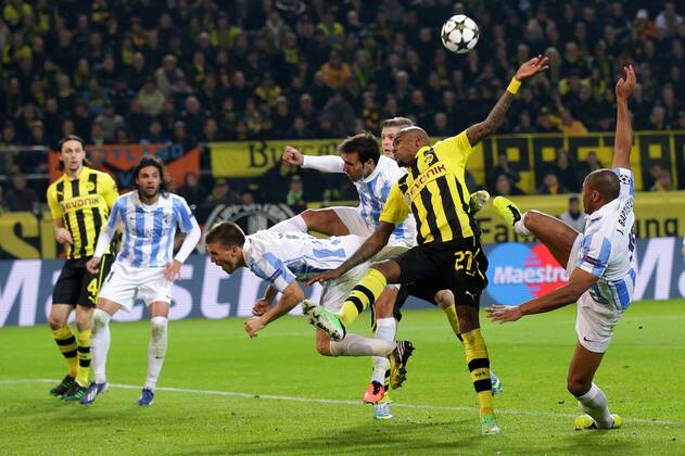 Felipe SANTANA (Borussia Dortmund - BVB - 27) inmitten von 3 Spielern des FC Malaga - Julio BAPTISTA, Julio CESAR BAPTISTA (FC Malaga - 10) - Ignacio CAMACHO, Ignacio CAMACHO BARNOLA (FC Malaga - 6) - Jesus GAMEZ, Jesus Gamez DUARTE (FC Malaga - 2) EP_Schmit