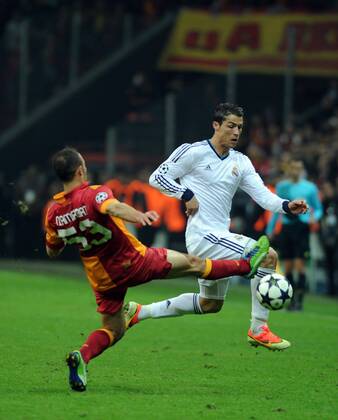 ISTANBUL, April 09, 2013 - Real Madrid s Cristiano Ronaldo (R) vies with Galatasaray s Nordin Amrabat during the UEFA Champions League quarter final second leg soccer match between Galatasaray and Real Madrid in Istanbul, Turkey, April 9, 2013. Real Madrid lost 2-3 but entered the semifinal with a total result 5-3.(Xinhua Ma Yan) TURKEY-ISTANBUL-SOCCER-UEFA 