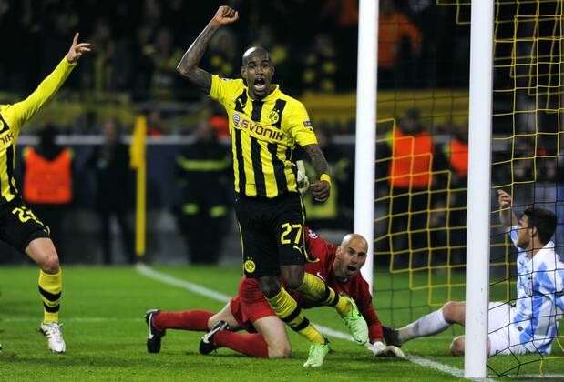 Fussball, UEFA Champions League, Herren, Saison 2012 2013, Matchday 10, Viertelfinal-Rückspiel, Signal Iduna Park Dortmund, Bor. Dortmund, BVB (gelb) - FC Malaga (weiss) 3:2; Jubel Felipe Santana (BVB) nachdem er das alles entscheidende Tor zum 3:2 in der Nachspielszeit erzielt hat, daneben Willy (Malaga) und Antunes (re., Malaga), Aktion.