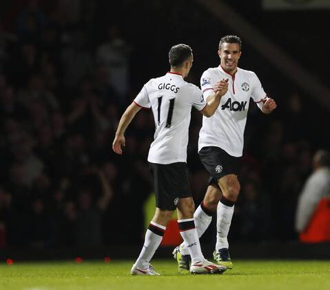 Manchester United s Robin Van Persie celebrates scoring his sides second goal..West Ham United v Manchester United (ManU) - Barclays Premier League - EDITORIAL USE ONLY. No use with unauthorised audio, video, data, fixture lists, club league logos or live services. Online in-match use limited to 120 images, no video emulation. No use in betting, games or single club league player publications.
