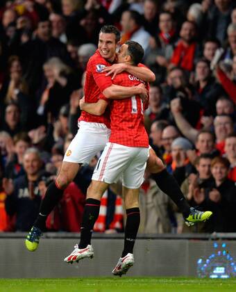 Goalscorer Robin van Persie of Manchester United celebrates his second goal with Ryan Giggs of Manchester United - Barclays Premier league - Manchester Utd vs Aston Villa - Old Trafford Stadium - Manchester - 22 04 13 - Picture Simon Bellis Sportimage EDITORIAL USE ONLY. No use with unauthorised audio, video, data, fixture lists, club league logos or live services. Online in-match use limited to 120 images, no video emulation. No use in betting, games or single club league player publications.