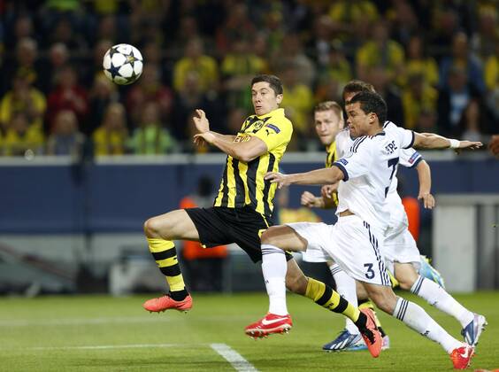 Dortmund s Robert Lewandowski scoring his sides opening goal..Borussia Dortmund v Real CF Madrid - Champions League, Semi Final 1st Leg- Westfalenstadion, Dortmund- 24 04 13 EDITORIAL USE ONLY. No use with unauthorised audio, video, data, fixture lists, club league logos or live services. Online in-match use limited to 120 images, no video emulation. No use in betting, games or single club league player publications.