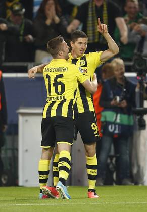 Dortmund s Robert Lewandowski celebrates scoring his sides opening goal..Borussia Dortmund v Real CF Madrid - Champions League, Semi Final 1st Leg- Westfalenstadion, Dortmund- 24 04 13 EDITORIAL USE ONLY. No use with unauthorised audio, video, data, fixture lists, club league logos or live services. Online in-match use limited to 120 images, no video emulation. No use in betting, games or single club league player publications.