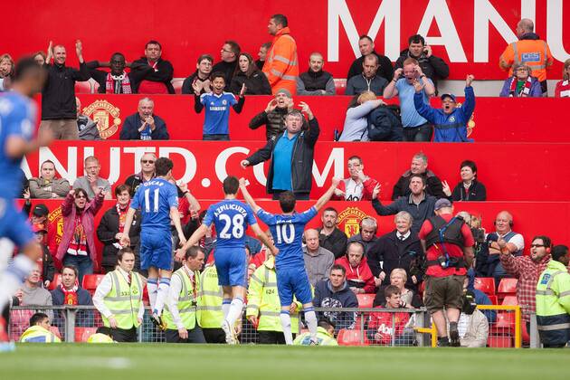 Football - 2012 2013 Premier League - Manchester United vs. Chelsea Juan Mata of Chelsea celebrates his goal in front of a mixed reception at Old Trafford