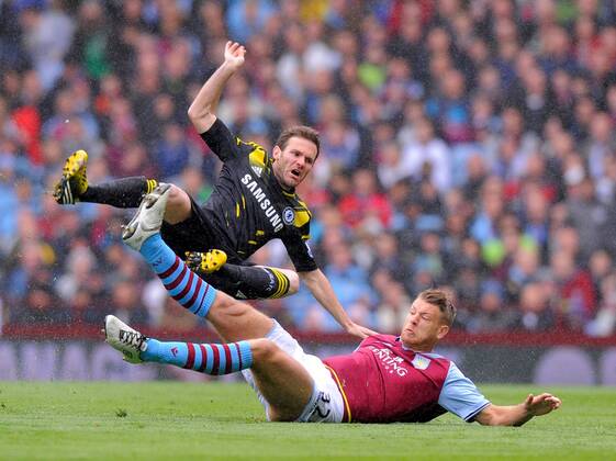 Nathan Baker of Aston Villa tackles Juan Mata of Chelsea, the tackle earned Baker a yellow card - Barclays Premier League - Aston Villa vs Chelsea - Villa Park Stadium - Birmingham - England - 11 05 13 - Picture Simon Bellis Sportimage EDITORIAL USE ONLY. No use with unauthorised audio, video, data, fixture lists, club league logos or live services. Online in-match use limited to 120 images, no video emulation. No use in betting, games or single club league player publications.