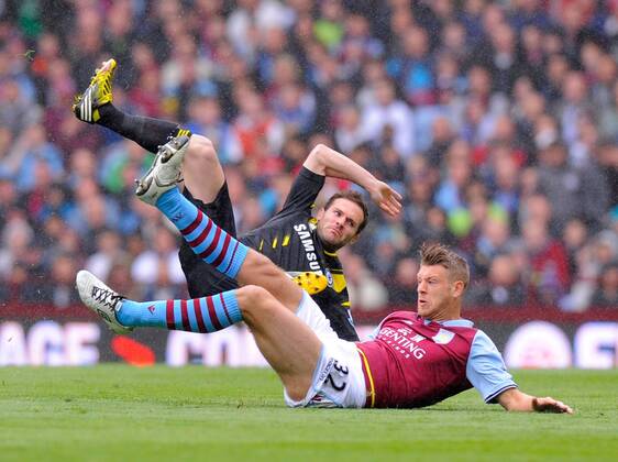 Nathan Baker of Aston Villa tackles Juan Mata of Chelsea, the tackle earned Baker a yellow card - Barclays Premier League - Aston Villa vs Chelsea - Villa Park Stadium - Birmingham - England - 11 05 13 - Picture Simon Bellis Sportimage EDITORIAL USE ONLY. No use with unauthorised audio, video, data, fixture lists, club league logos or live services. Online in-match use limited to 120 images, no video emulation. No use in betting, games or single club league player publications.