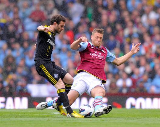 Nathan Baker of Aston Villa tackles Juan Mata of Chelsea, the tackle earned Baker a yellow card - Barclays Premier League - Aston Villa vs Chelsea - Villa Park Stadium - Birmingham - England - 11 05 13 - Picture Simon Bellis Sportimage EDITORIAL USE ONLY. No use with unauthorised audio, video, data, fixture lists, club league logos or live services. Online in-match use limited to 120 images, no video emulation. No use in betting, games or single club league player publications.
