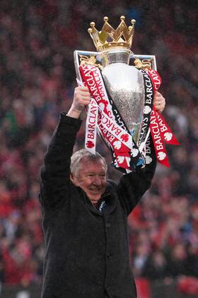 Football - Premier League 2012 2013 - Manchester United - Alex Ferguson, manager of Manchester United celebrates with the trophy at Old Trafford
