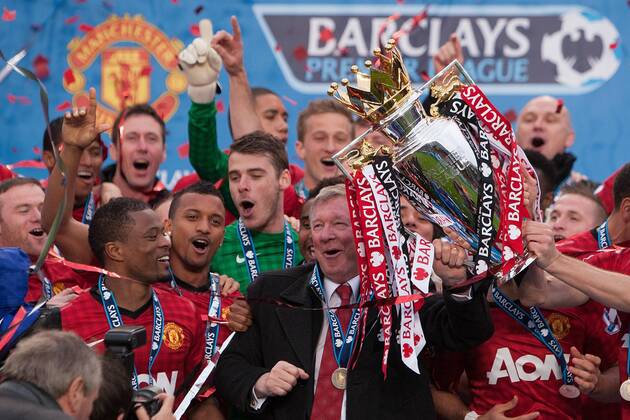Football - Premier League 2012 2013 - Manchester United - Alex Ferguson, manager of Manchester United leads celebrations with the trophy at Old Trafford