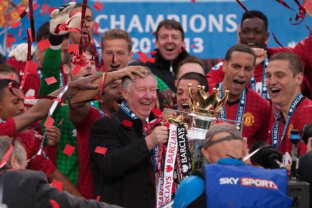 Football - Premier League 2012 2013 - Manchester United - Alex Ferguson, manager of Manchester United leads celebrations with the trophy at Old Trafford