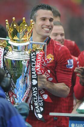 Robin van Persie of Manchester United lifts the Premier League trophy - Barclays Premier League - Manchester United ManU - Old Trafford Stadium - Manchester - England - 12 05 13 - EDITORIAL USE ONLY. No use with unauthorised audio, video, data, fixture lists, club league logos or live services. Online in-match use limited to 120 images, no video emulation. No use in betting, games or single club league player publications.