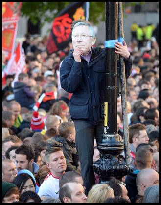 Manchester United Fans wait for Manchester United players to turn up in Albert Square, Manchester, Manchester United celebrate winning their 20th league title winning the Premier League, Monday May 13, 2013. AndrewxParsonsx xi-Images AJP