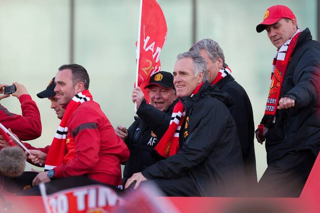 Alex Ferguson, manager of Manchester United gets into the party mood waving a flag - Manchester United - Premier League Trophy Parade - Manchester - England -13 05 2013 - EDITORIAL USE ONLY. No use with unauthorised audio, video, data, fixture lists, club league logos or live services. Online in-match use limited to 120 images, no video emulation. No use in betting, games or single club league player publications.