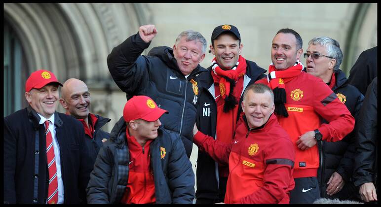 Sir Alex Ferguson takes a picture on his Mobile phone of the fans in Albert Square, Manchester, As Manchester United celebrate winning their 20th league title winning the Premier League, Monday May 13, 2013. AndrewxParsonsx xi-Images AJP