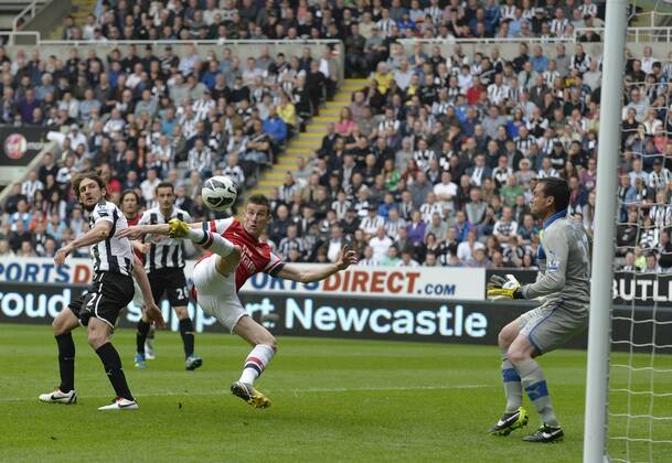 Laurent Koscielny of Arsenal scores their first goal - Barclays Premier League - Newcastle United - Arsenal FC London. St. James Park - Newcastle - 19 05 2013 - PicxRichardxLee Sportimage EDITORIAL USE ONLY. No use with unauthorised audio, video, data, fixture lists, club league logos or live services. Online in-match use limited to 120 images, no video emulation. No use in betting, games or single club league player publications.