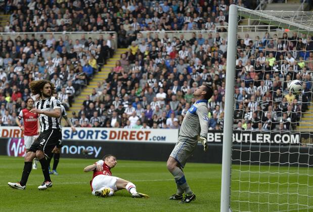 Laurent Koscielny of Arsenal scores their first goal - Barclays Premier League - Newcastle United - Arsenal FC London. St. James Park - Newcastle - 19 05 2013 - PicxRichardxLee Sportimage EDITORIAL USE ONLY. No use with unauthorised audio, video, data, fixture lists, club league logos or live services. Online in-match use limited to 120 images, no video emulation. No use in betting, games or single club league player publications.