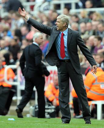 Football - English Premiership - Newcastle v Arsenal Arsene Wenger of Arsenal gestures during the Newcastle v Arsenal, Barclay s Premier League football match at St James Park, Newcastle. Colorsport 19th May 2013