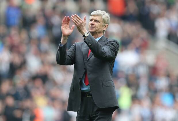 Football - English Premiership - Newcastle v Arsenal Arsesnal manager Arsene Wenger celebrates securing Champions League football during the Newcastle v Arsenal, Barclay s Premier League football match at St James Park, Newcastle. Colorsport 19th May 2013
